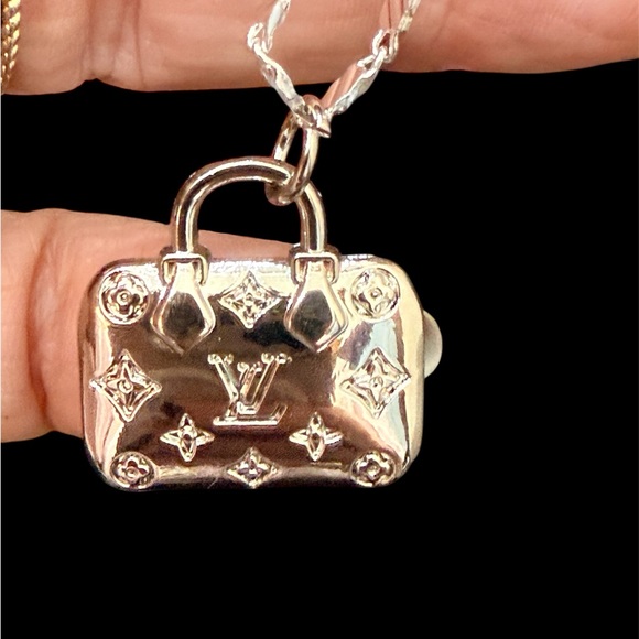 LV authentic silver tone zip pull depicting a LV
Bag. 16” sterling marine chain. - Picture 2 of 6